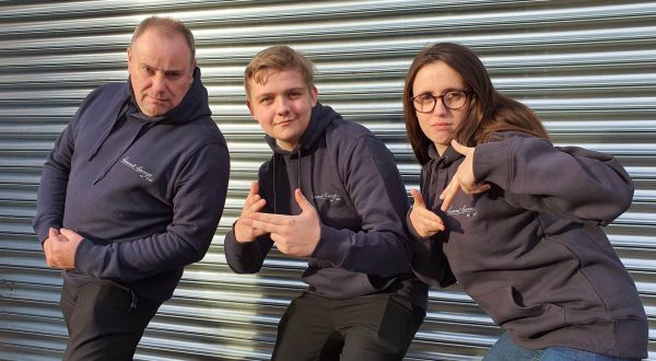 The Summit Garage team wearing the ‘Original’ Summit Garage Hooded Sweatshirt